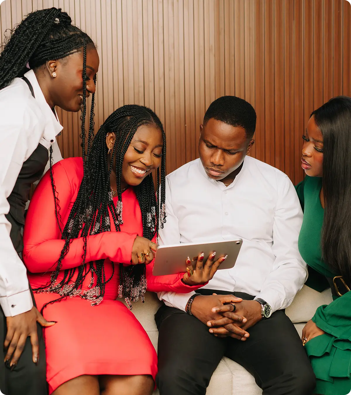 Startup team reviewing work together on a tablet